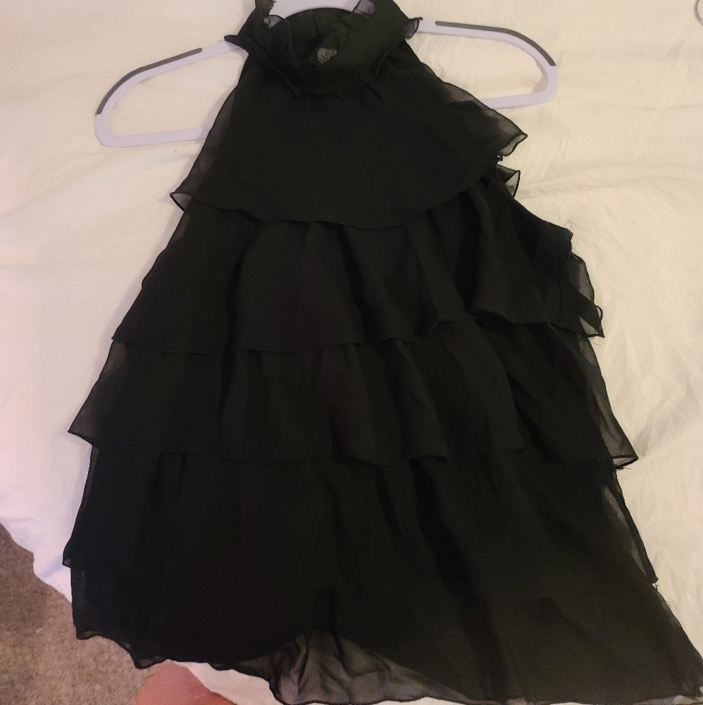 Sleeveless black ruffle top